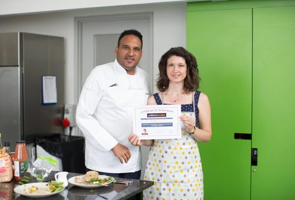 Proud winner Alida Zamparini shows off her certificate with Michael Caines